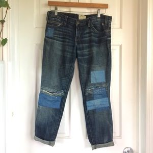 Distressed jeans w/ indigo patches and mending